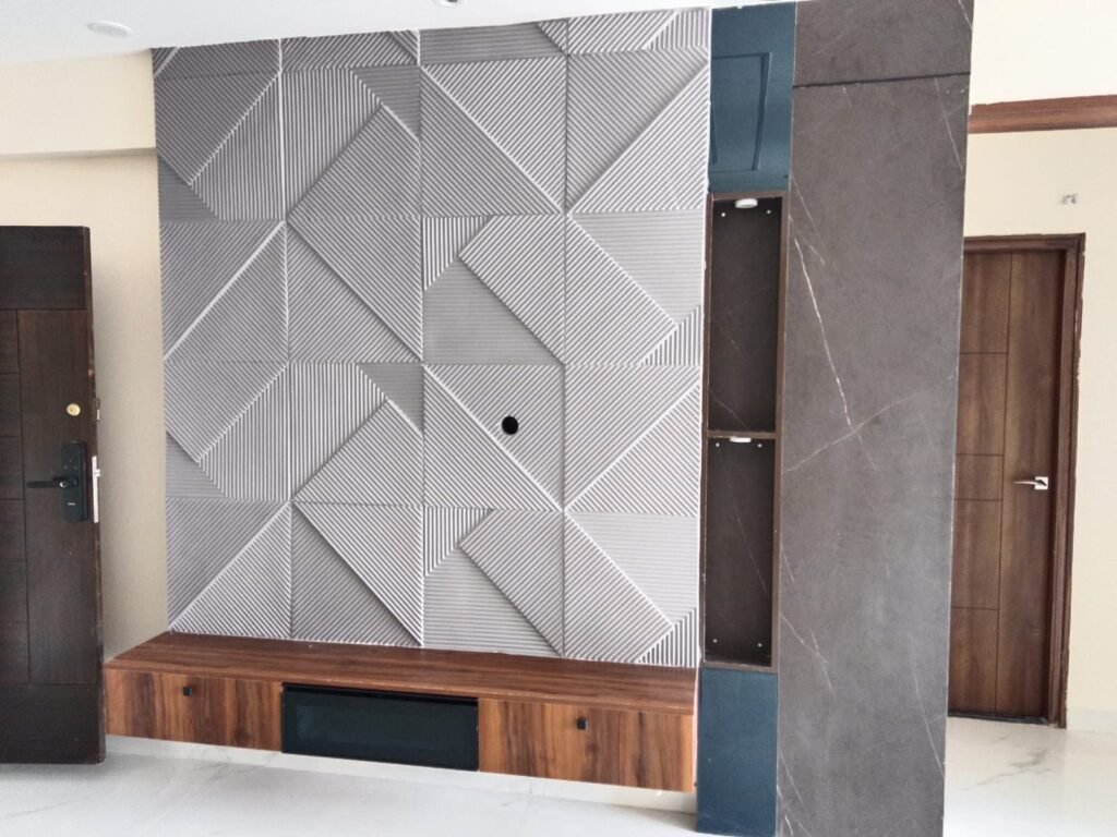 TV wall with 3D textured panels and a wooden console