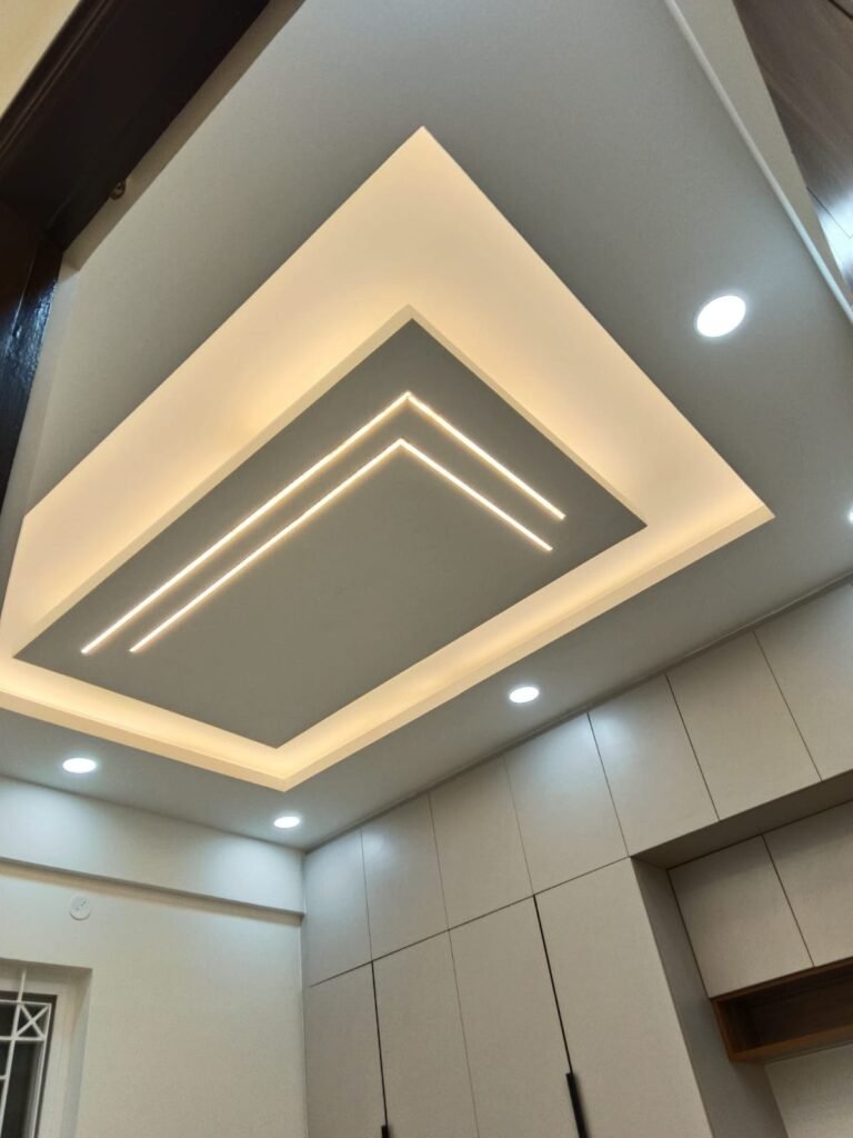 False ceiling with cove lighting and recessed spotlights