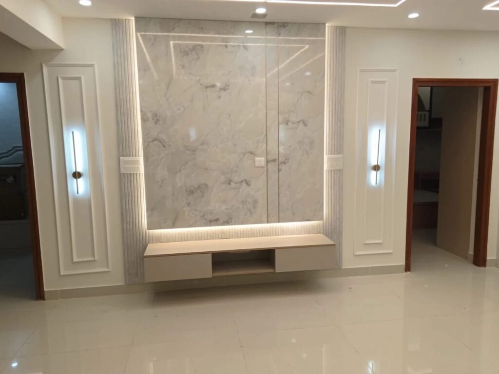 TV unit wall with a marble-finish panel and floating console