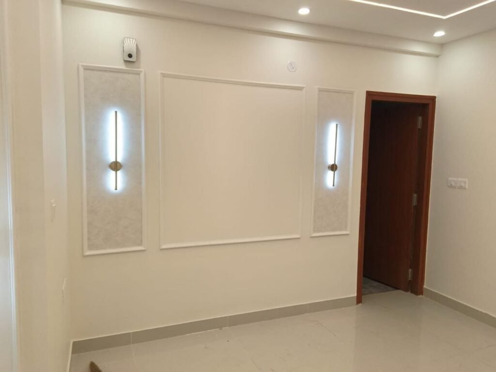 Wall moulding panels with vertical wall lights