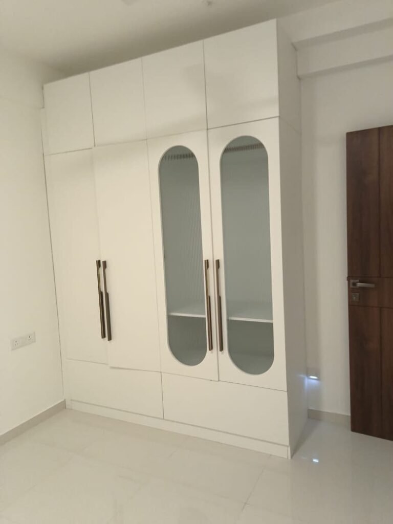 Wardrobe with arched frosted-glass doors