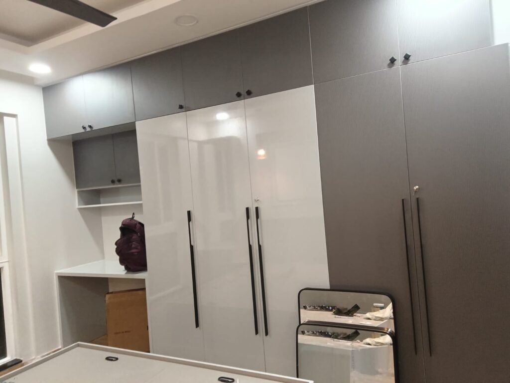 Floor-to-ceiling white gloss wardrobe